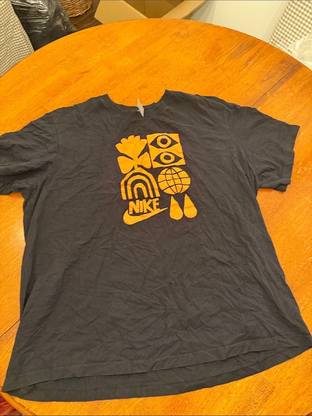 Nike Black Short-Sleeve Tee with Orange Graphic Icons